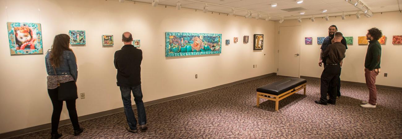 People viewing artwork at the Fisher Gallery